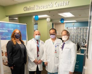 Research & Evaluation and LAMC leadership in front of the Clinical Research Center in Los Angeles